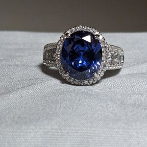 brand new tanzanite and white sapphire ring set in rhodium